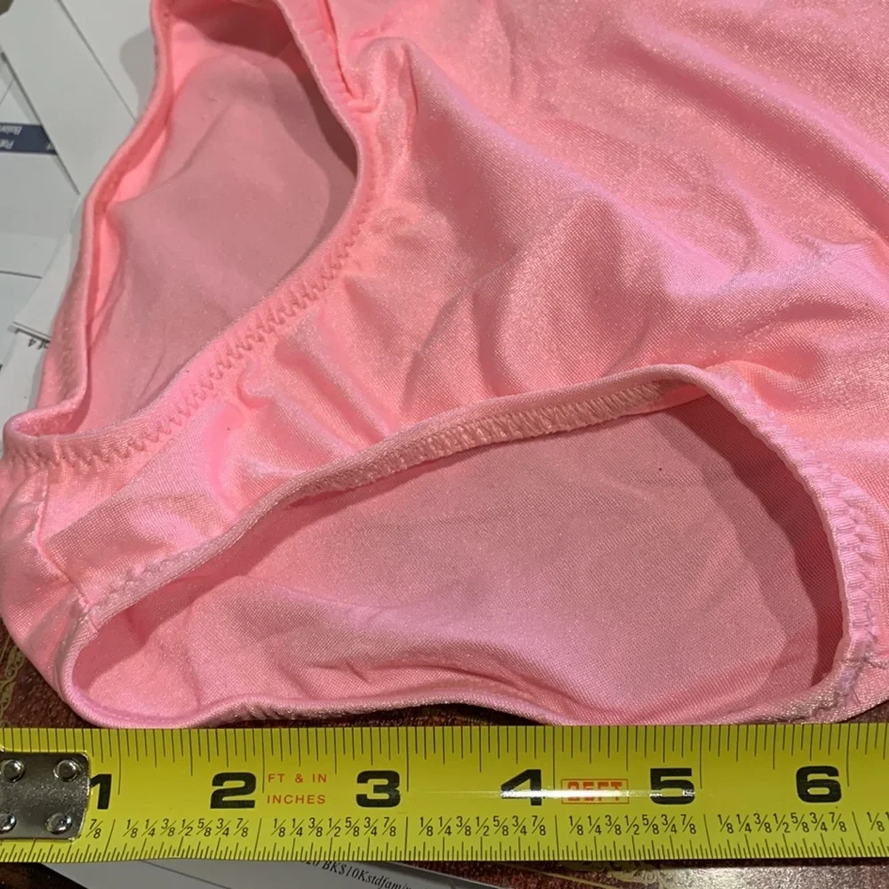 Dansco pink leotard with halter tie and trimmed in silver sequins